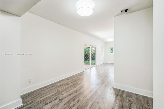 empty room featuring wood-type flooring