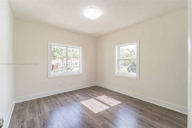 spare room featuring dark hardwood / wood-style flooring