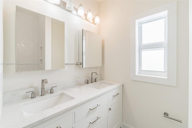 bathroom featuring double vanity