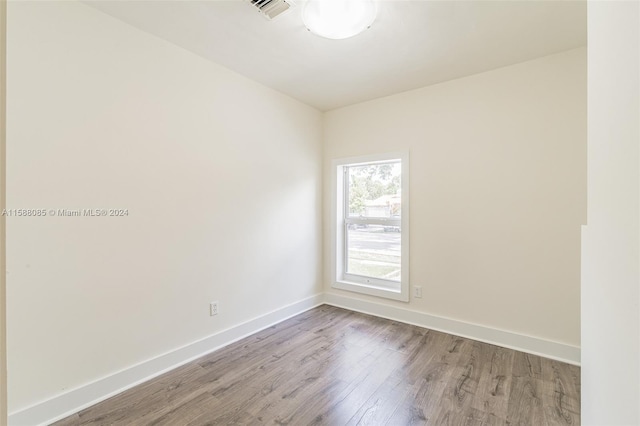 empty room with wood-type flooring