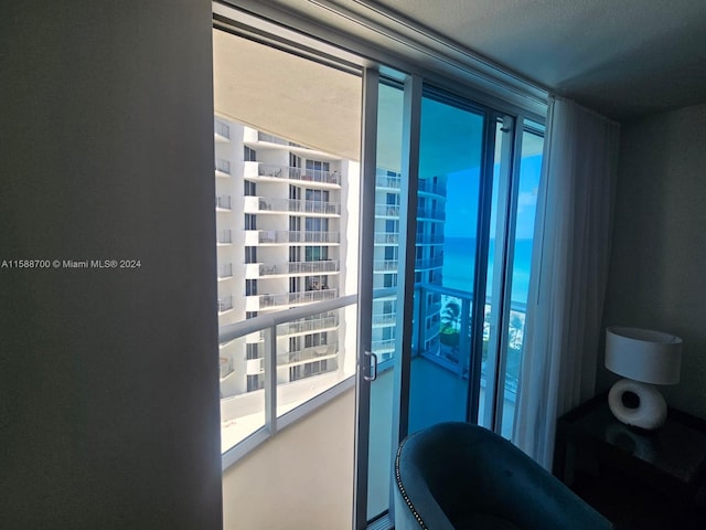 balcony with a view of the beach and a water view