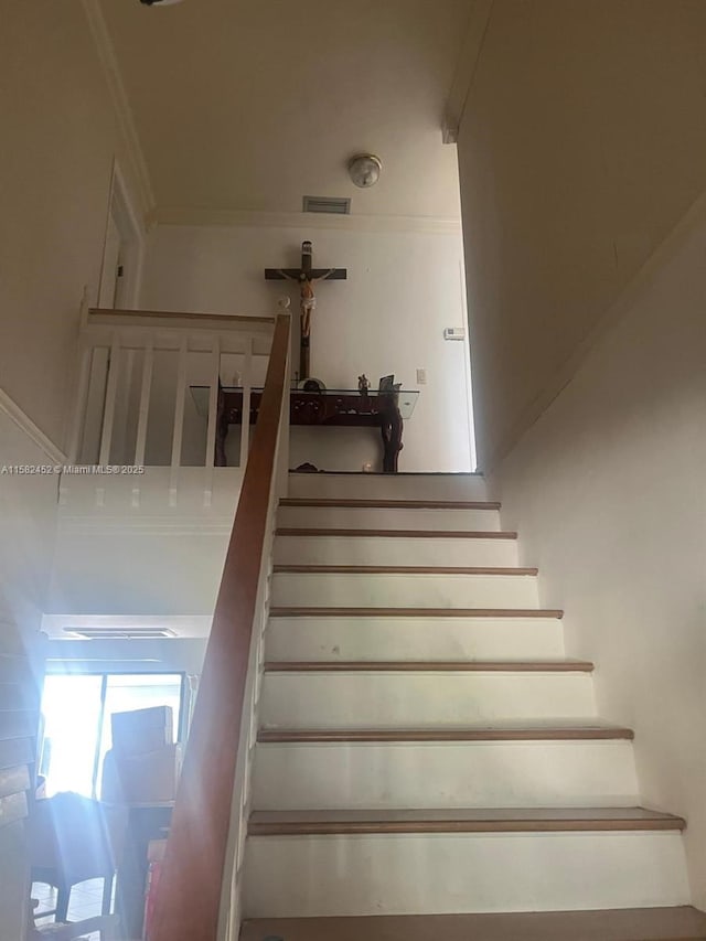 stairs featuring ornamental molding