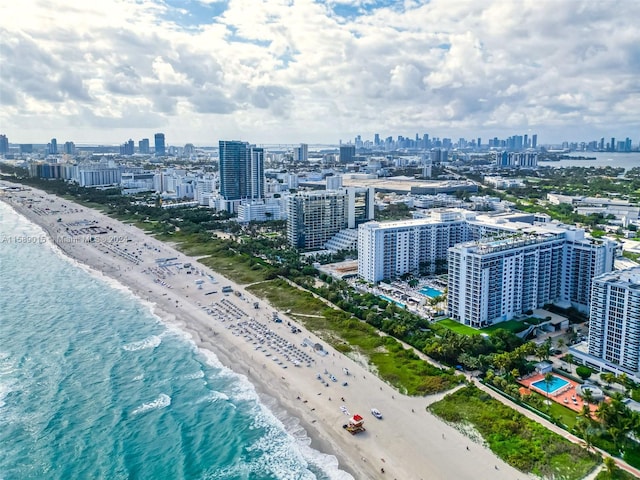 aerial view featuring a water view and a beach view