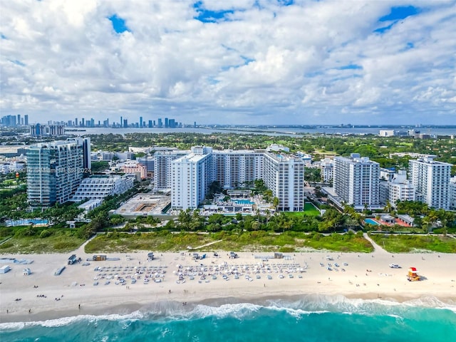 aerial view featuring a view of the beach and a water view