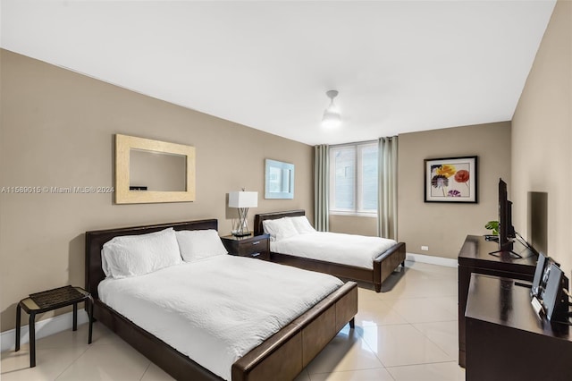 bedroom with light tile patterned flooring