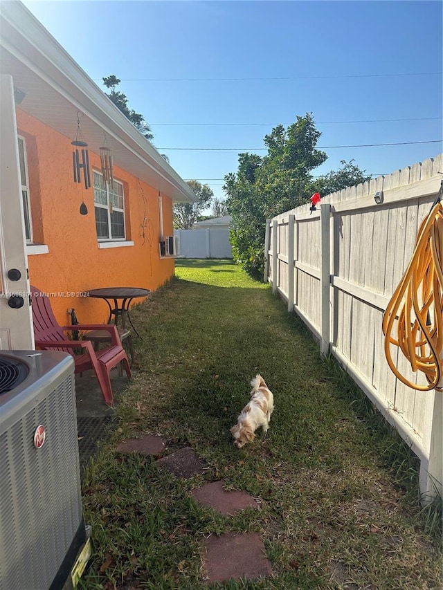 view of yard with central air condition unit