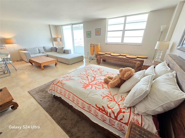 tiled bedroom with expansive windows