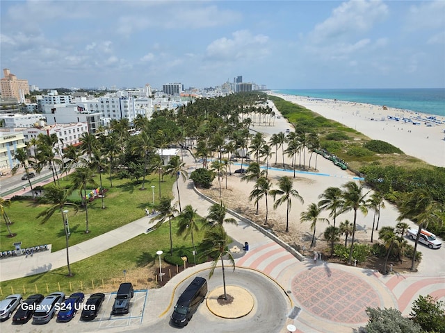 aerial view featuring a view of the beach and a water view