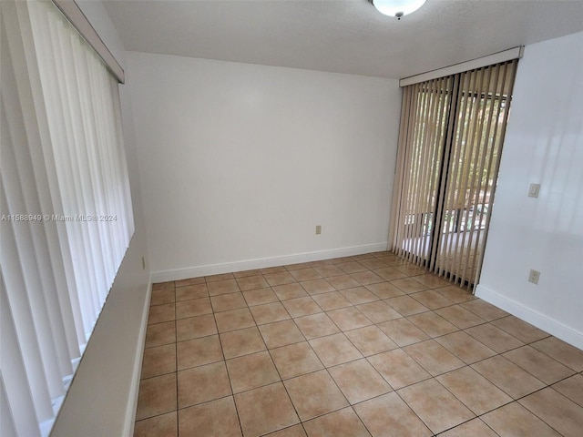 view of tiled spare room