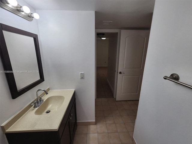 bathroom featuring tile patterned flooring and vanity