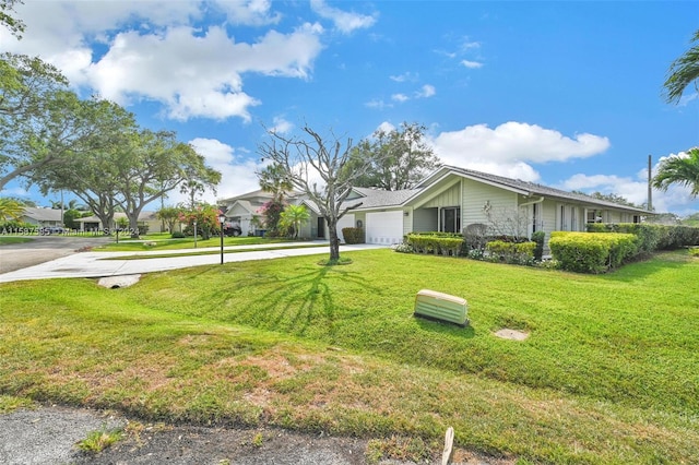 view of front facade with a front lawn and a garage