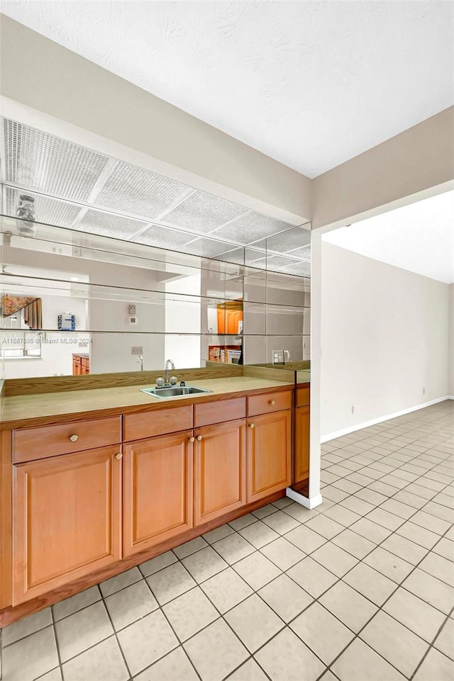 kitchen with sink and light tile patterned floors