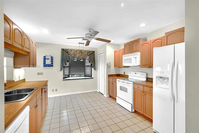 kitchen with white appliances, ceiling fan, light tile patterned flooring, and sink