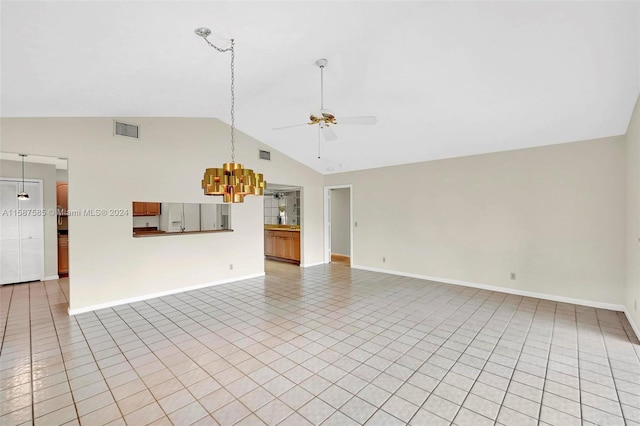 unfurnished living room featuring high vaulted ceiling, light tile patterned floors, and ceiling fan with notable chandelier