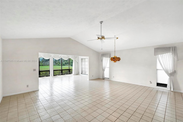 unfurnished living room featuring ceiling fan, light tile patterned flooring, and vaulted ceiling