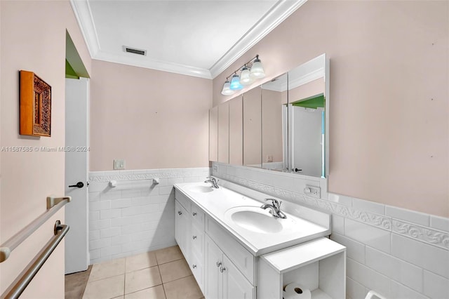 bathroom featuring vanity, tile walls, ornamental molding, and tile patterned flooring