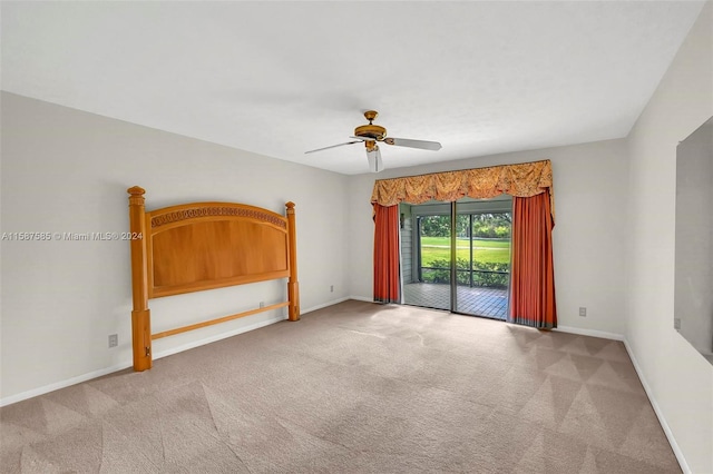 empty room featuring carpet flooring and ceiling fan