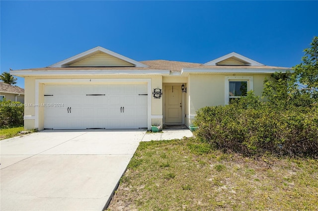 ranch-style house featuring a garage