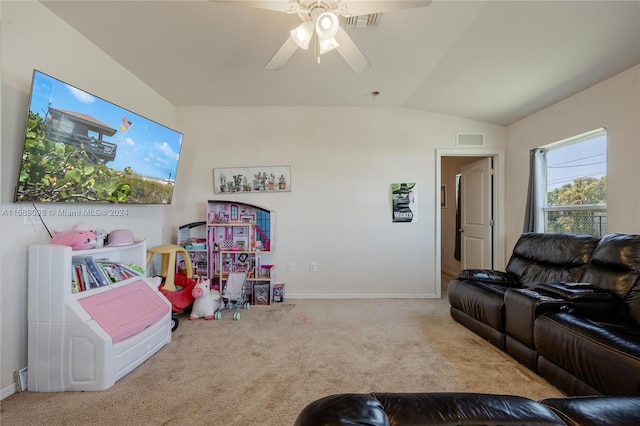 carpeted living room featuring ceiling fan and lofted ceiling