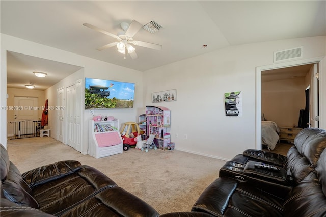 living room with light carpet, lofted ceiling, and ceiling fan