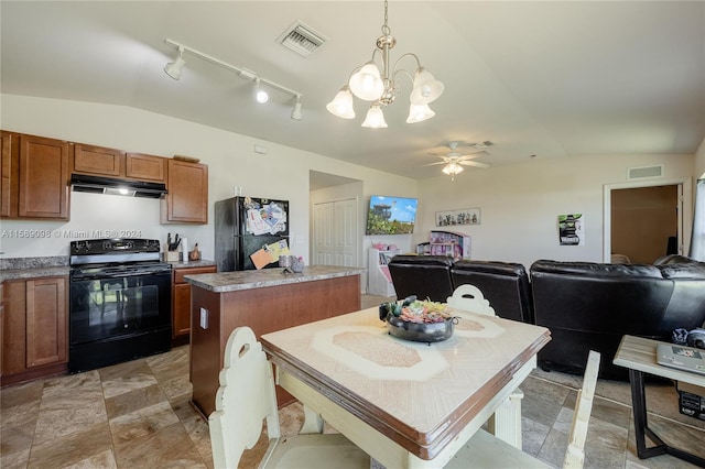 kitchen with extractor fan, pendant lighting, black appliances, rail lighting, and a center island