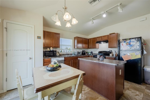 kitchen featuring hanging light fixtures, a kitchen island, black appliances, rail lighting, and vaulted ceiling