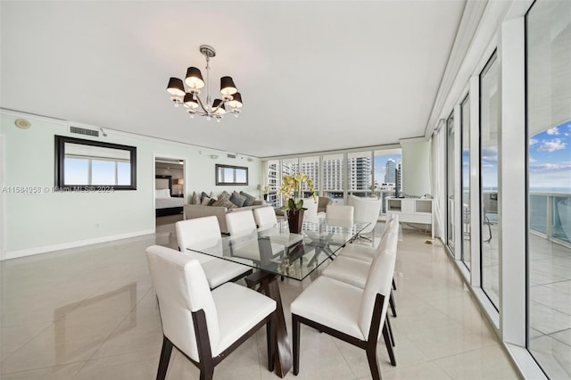 dining area featuring a notable chandelier, a wealth of natural light, and light tile floors