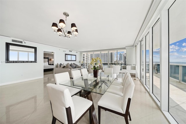 tiled dining room featuring plenty of natural light and a notable chandelier