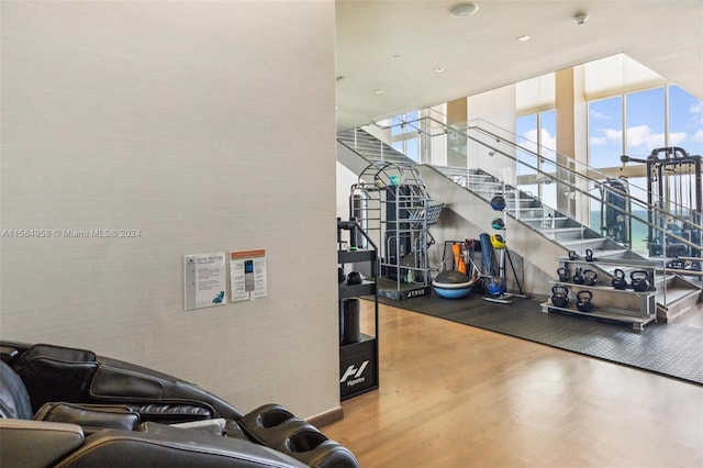 gym with wood-type flooring