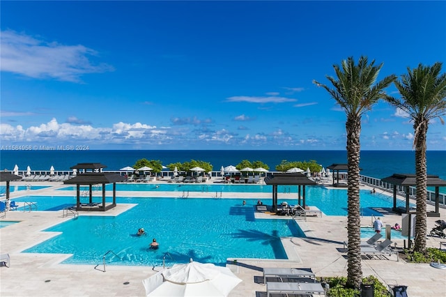 view of pool featuring a water view