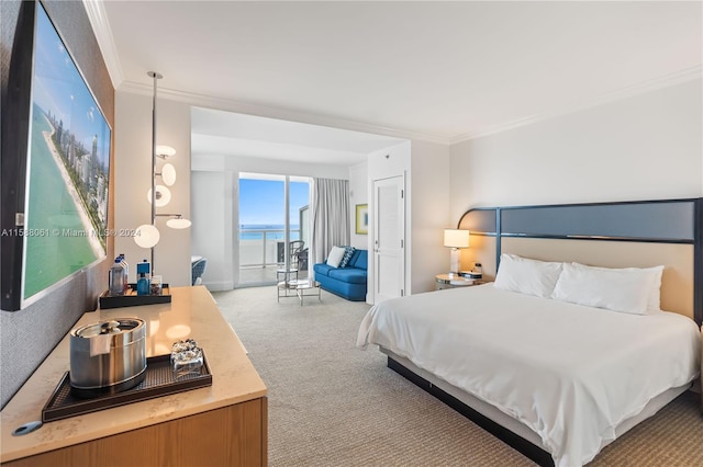 bedroom featuring crown molding, carpet flooring, and a water view