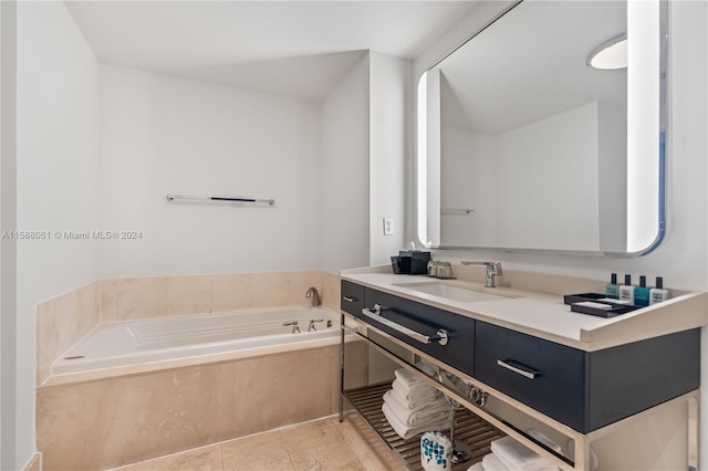 bathroom with a bathtub, tile flooring, and vanity