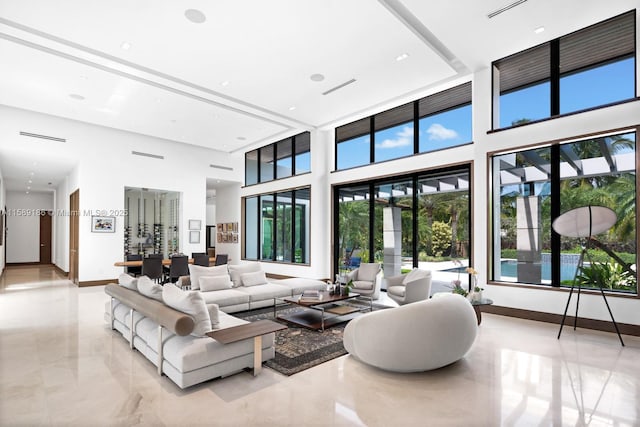 living room featuring a high ceiling