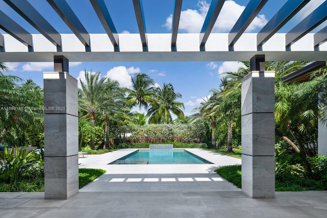 view of pool with a pergola and a patio