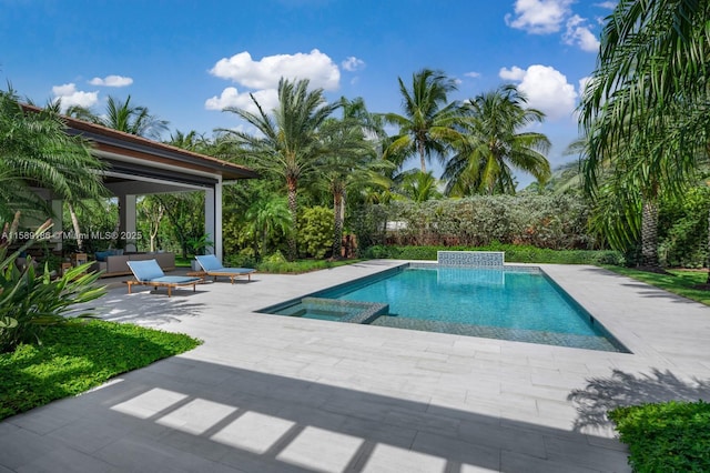 view of swimming pool featuring a patio area