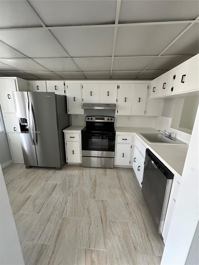 kitchen featuring white cabinetry, sink, a drop ceiling, and appliances with stainless steel finishes