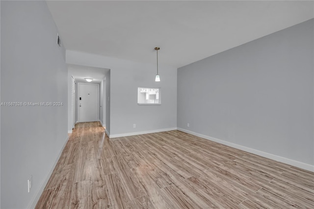 unfurnished room with light hardwood / wood-style flooring