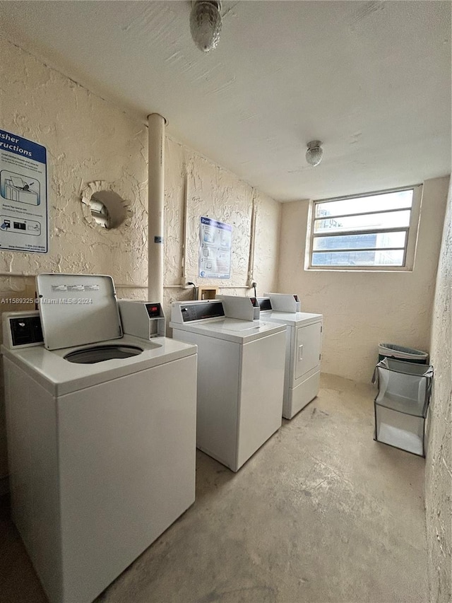 washroom featuring washer and clothes dryer