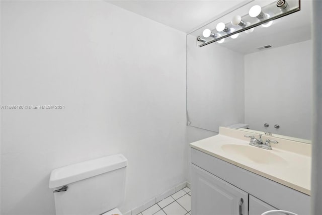 bathroom featuring tile flooring, oversized vanity, and toilet