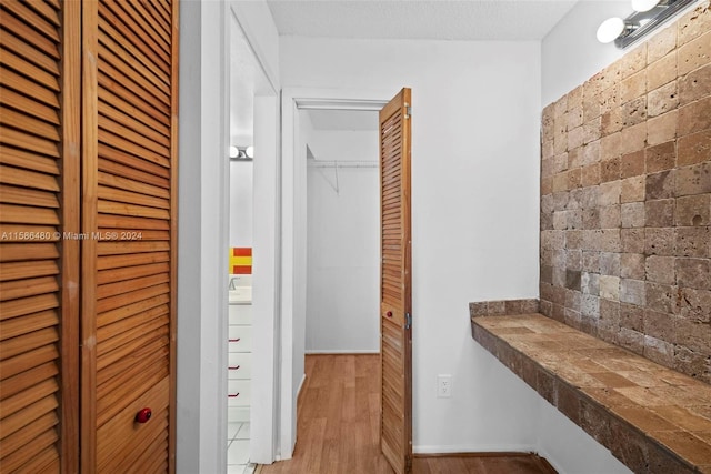 hallway featuring wood-type flooring