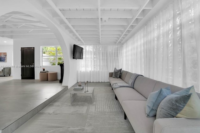 living room featuring concrete flooring