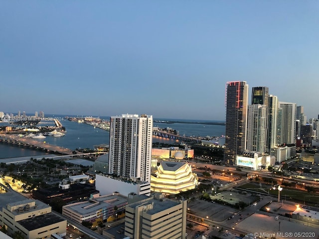 property's view of city featuring a water view