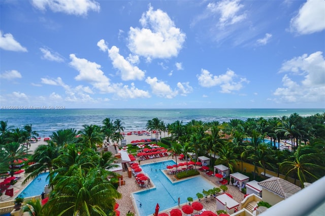 birds eye view of property with a water view