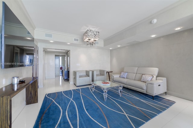 living room featuring a notable chandelier, tile patterned floors, crown molding, and a tray ceiling