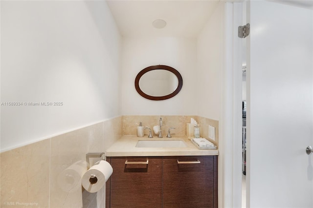 10090 Bay Harbor Ter Unit 10090, Bay Harbor Islands, FL 33154 - bathroom with vanity and tile walls