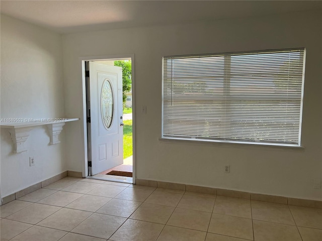 entrance foyer featuring a wealth of natural light and light tile floors