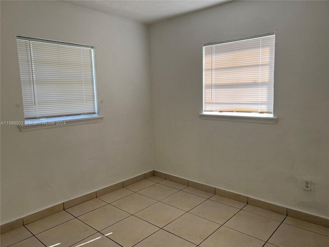 empty room with light tile floors