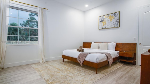 bedroom with light wood-type flooring