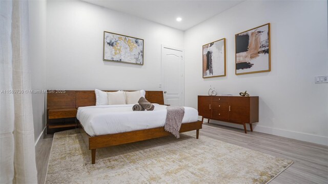 bedroom featuring light wood-type flooring