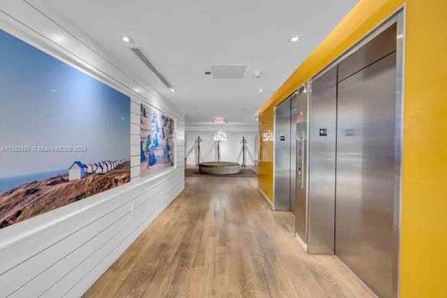 hall featuring light hardwood / wood-style floors and elevator